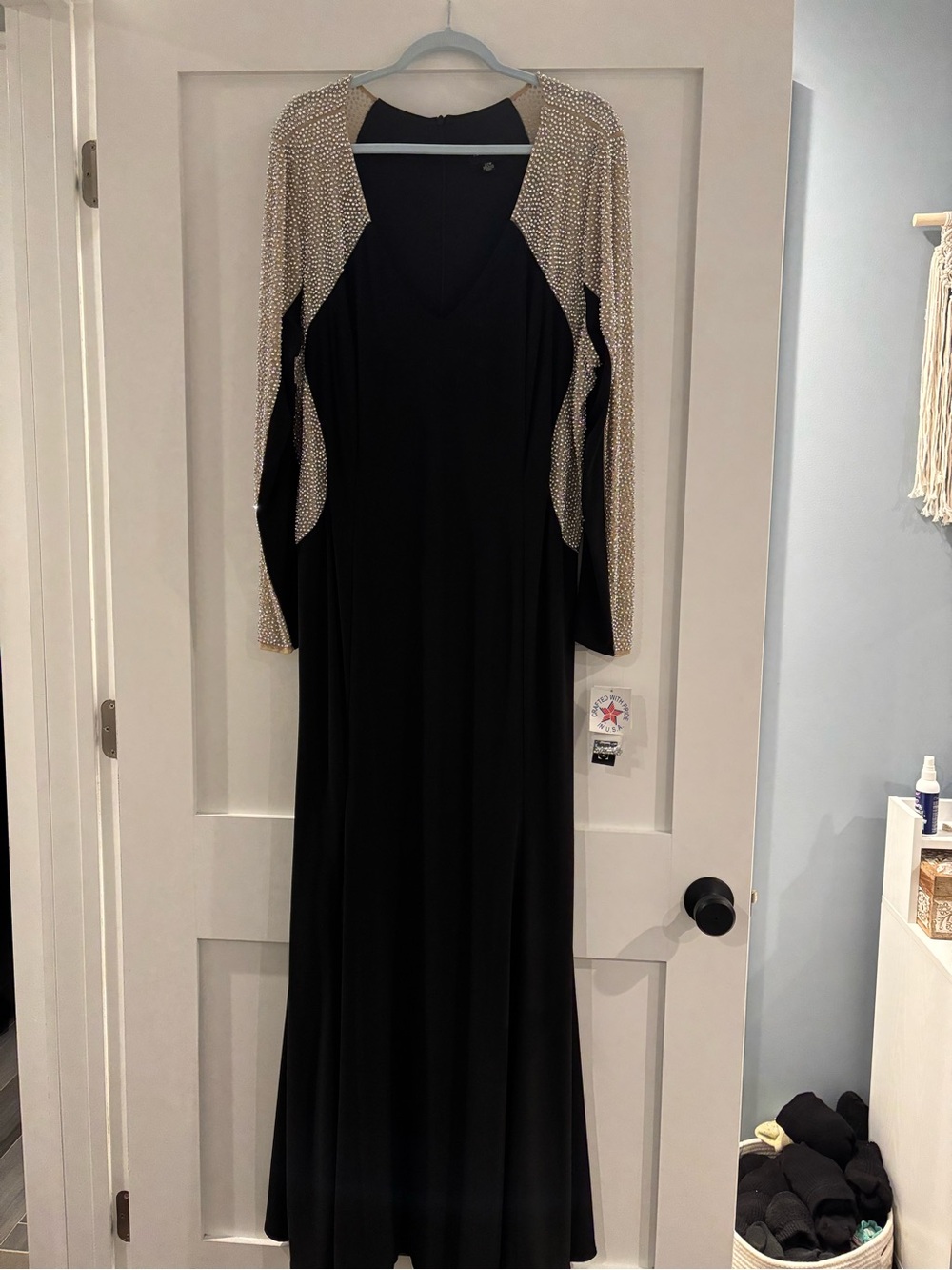 Xscape Black Long-Sleeve Evening Gown with Gold Beaded Shoulders